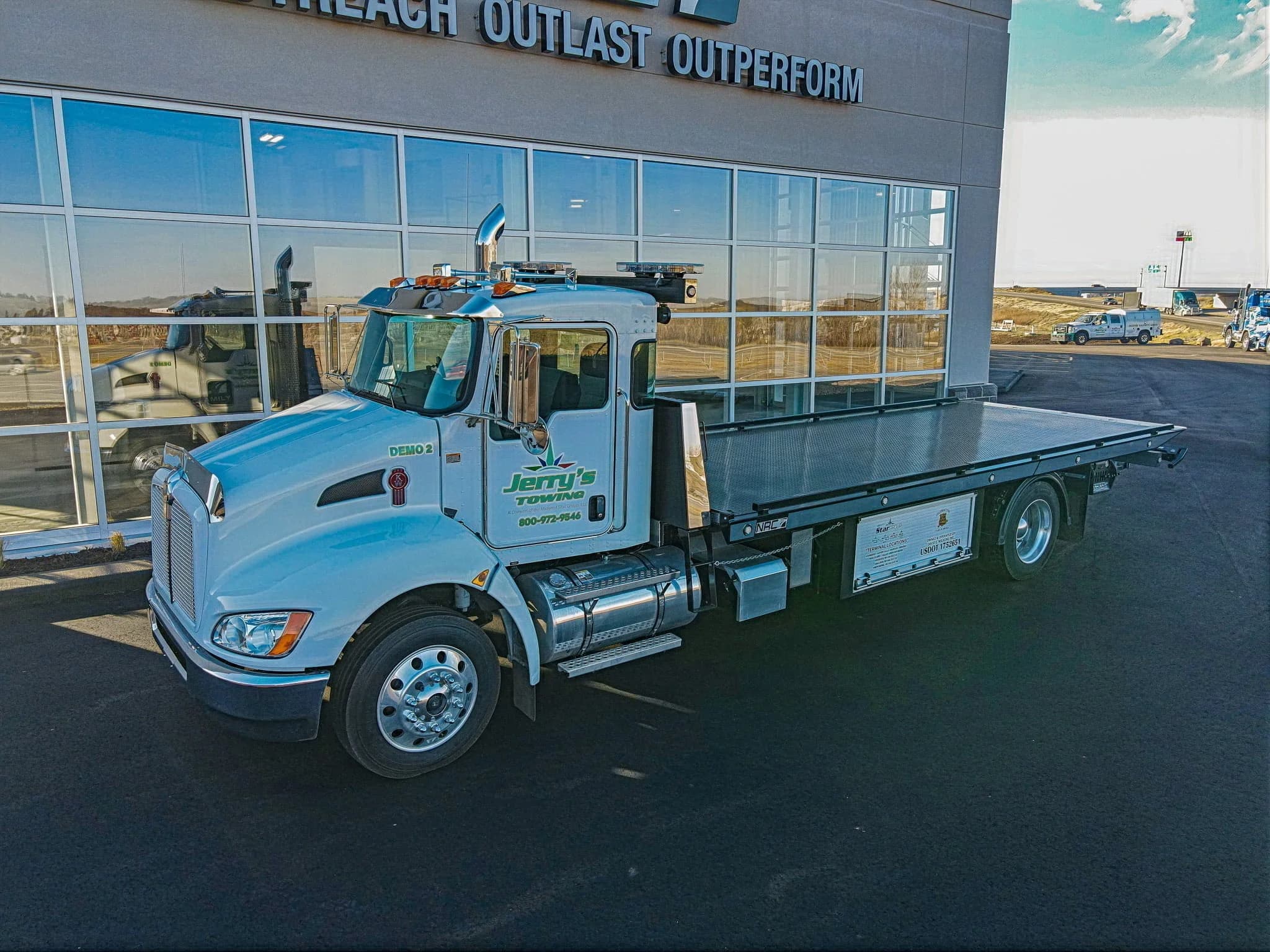 Flatbed carrier service by Jerry's Towing